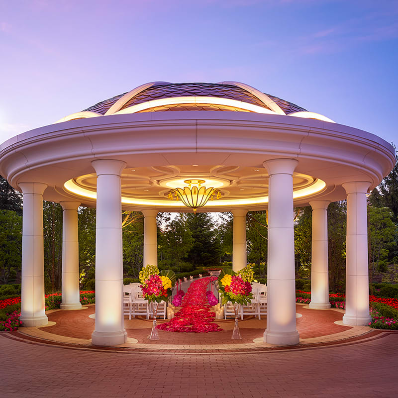 The gazebo at dusk with the Encore Boston Harbor building in the background