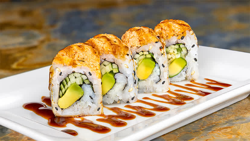 Sushi sitting on a white plate