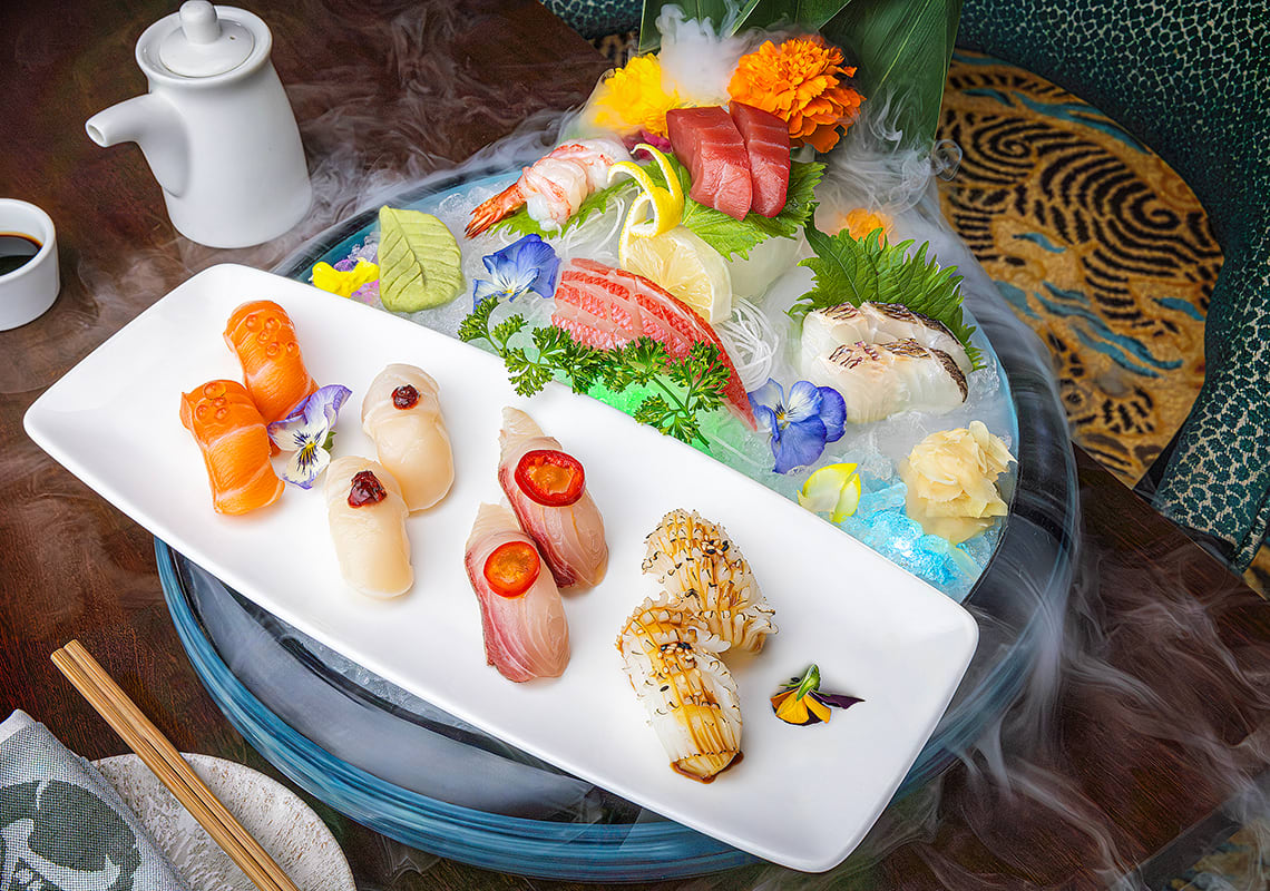 Several pieces of sushi on a platter