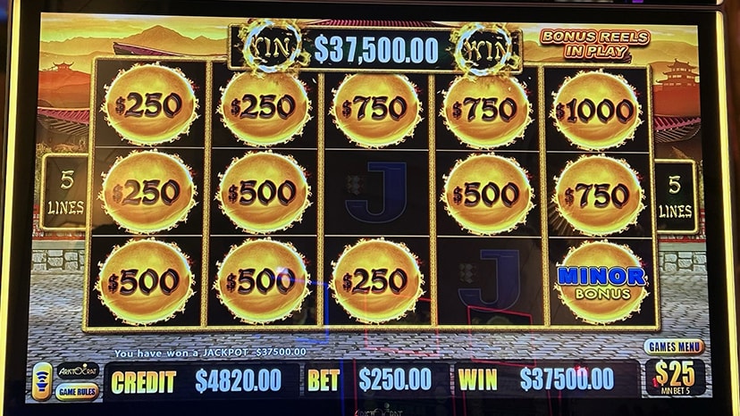 A slot machine screen showing a $37,500 win