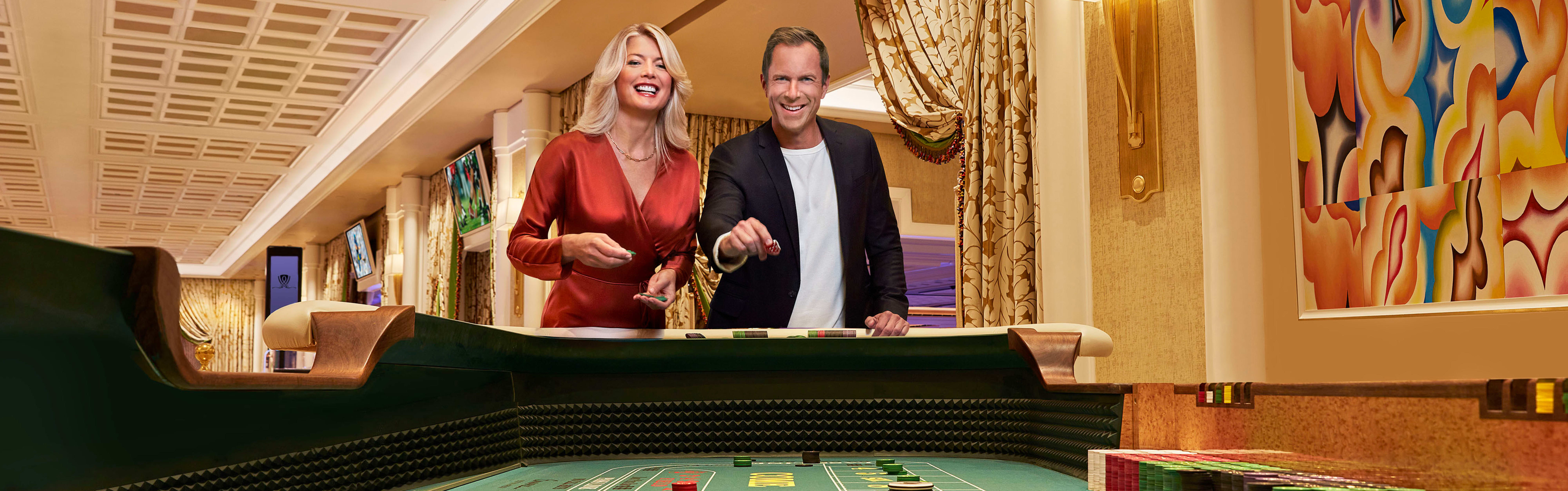 Couple playing craps at casino