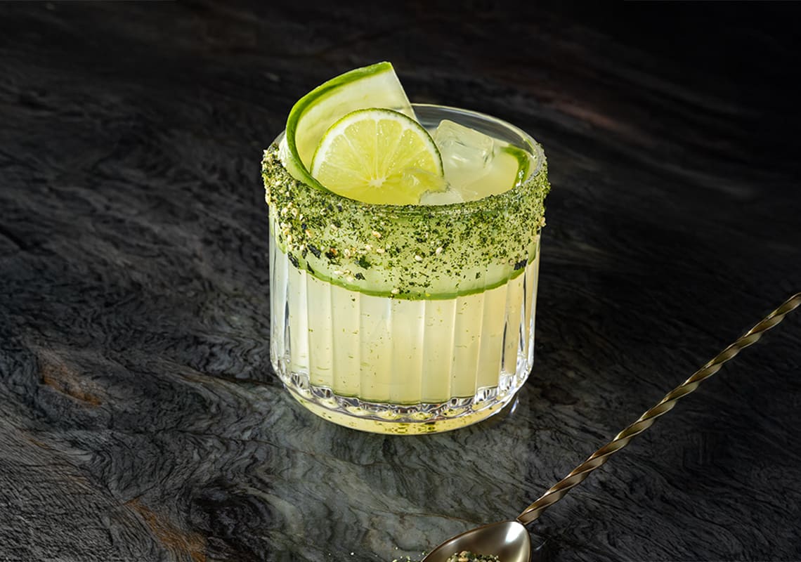 The Coralita cocktail with lime garnish