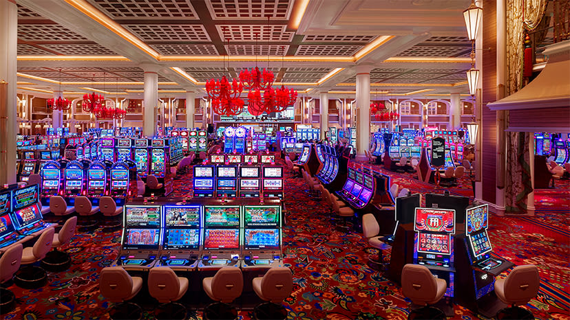 Rows of slot machines at Encore Boston Harbor casino