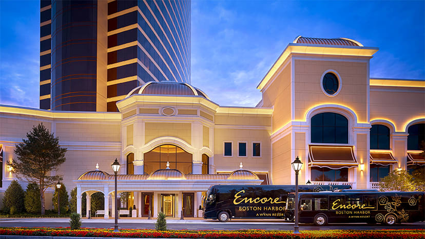 Shuttle buses are parked in front of Encore Boston Harbor