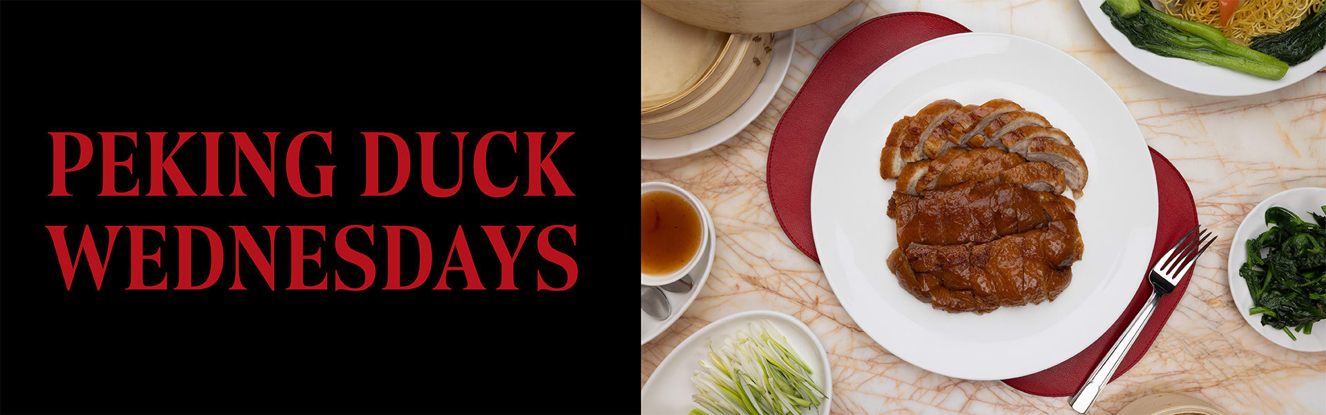 A plate of Peking Duck surrounded by sides at Red 8