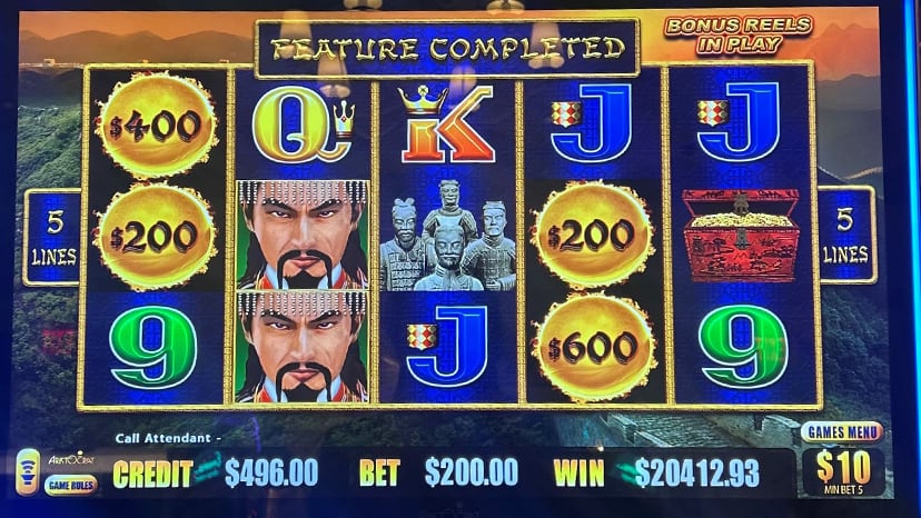 A slot machine screen showing a win of $20,412.