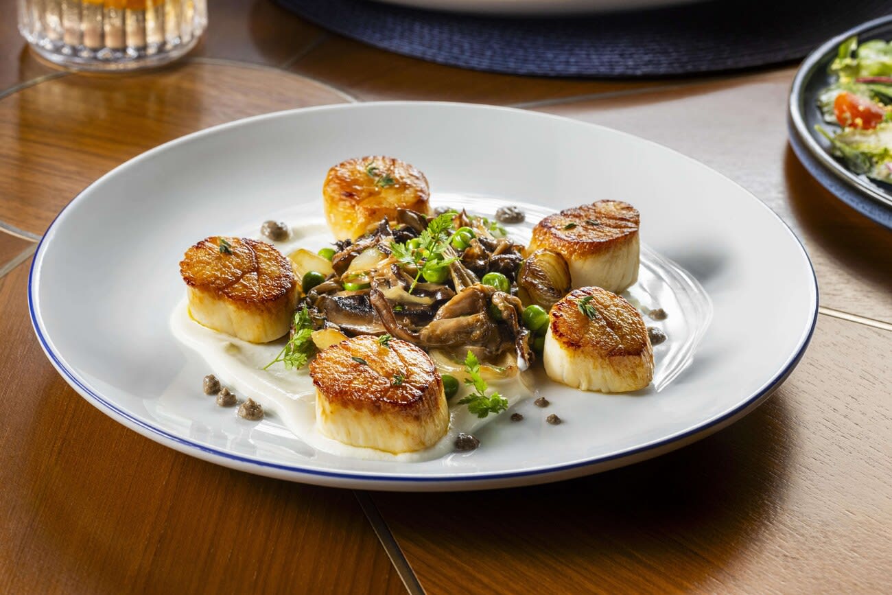 Seared scallops at Encore Boston Harbor