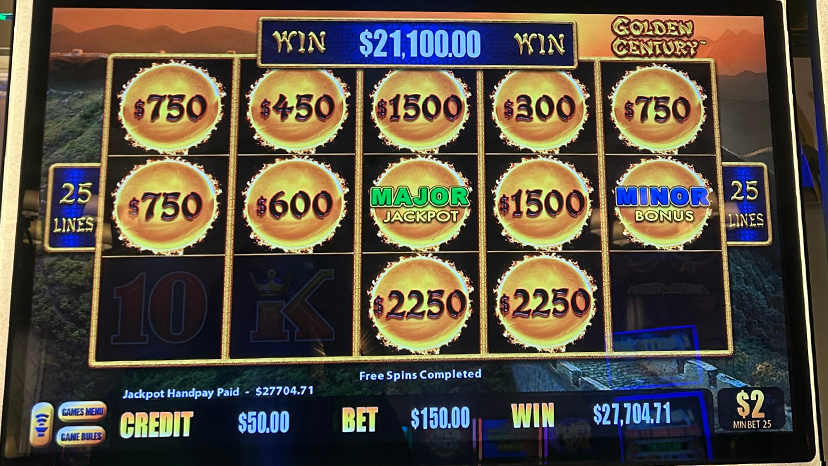 A slot machine screen showing a win of $27,704.