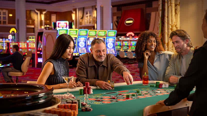 Two people play roulette at Encore Boston Harbor