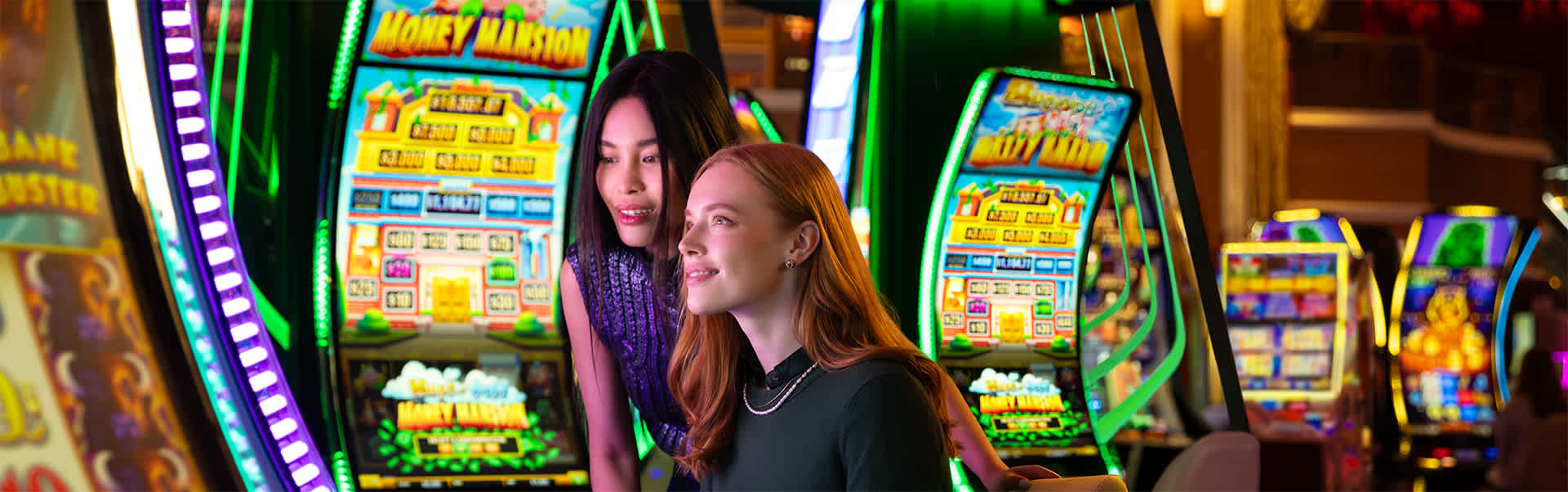 A woman sits and plays a slot machine game