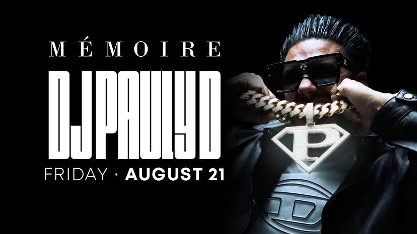 DJ Pauly D holds a chain with the letter P on it