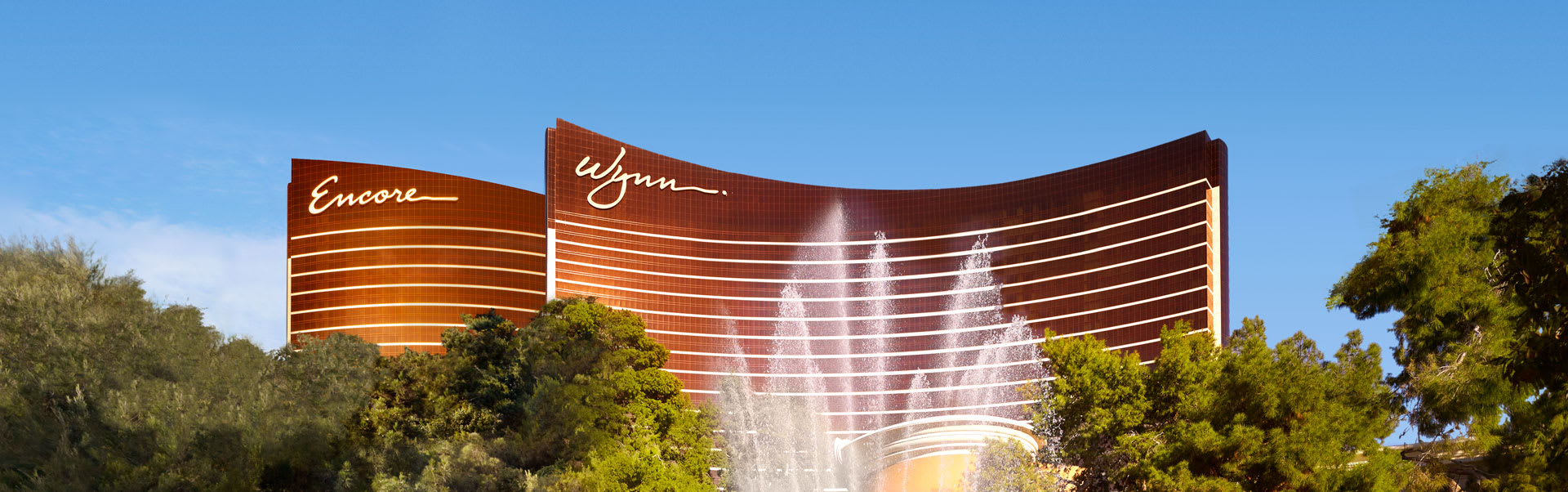 The Wynn Las Vegas and Encore exterior daytime with fountains