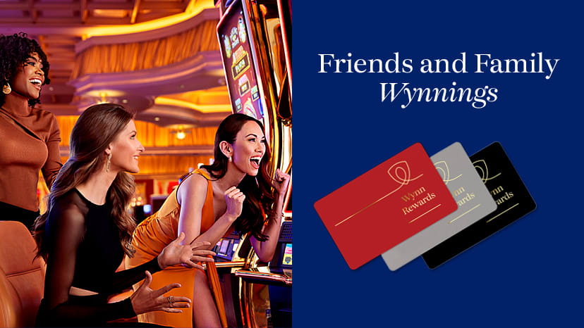 Guests playing slot machines with 3 Wynn Rewards cards